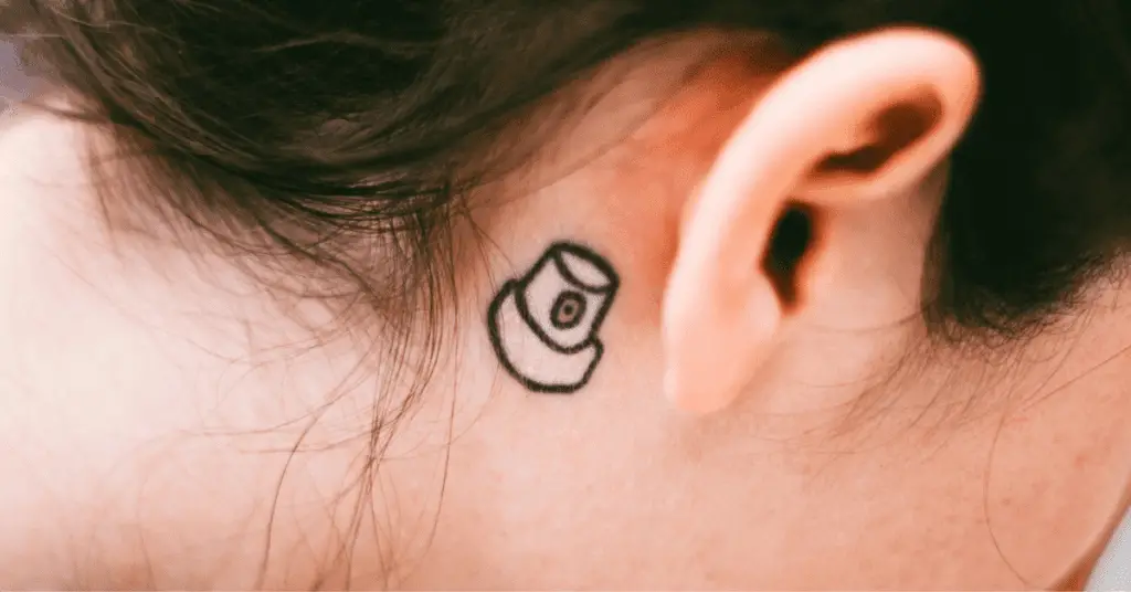 do behind ear tattoos hurt pain level process and aftercare