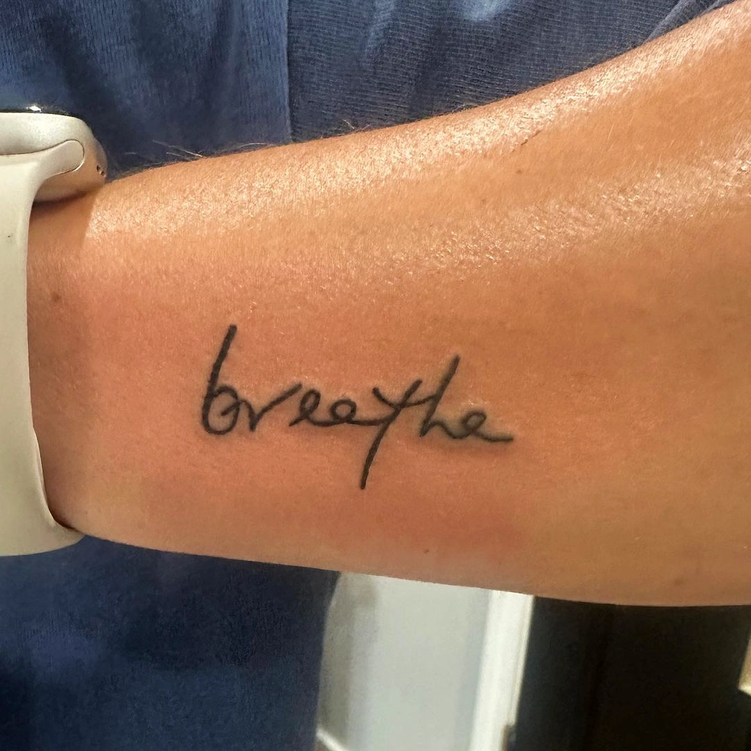 Breathe Strength Script Tattoo