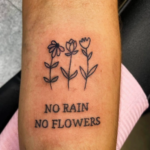 Floral Resilience Message Tattoo