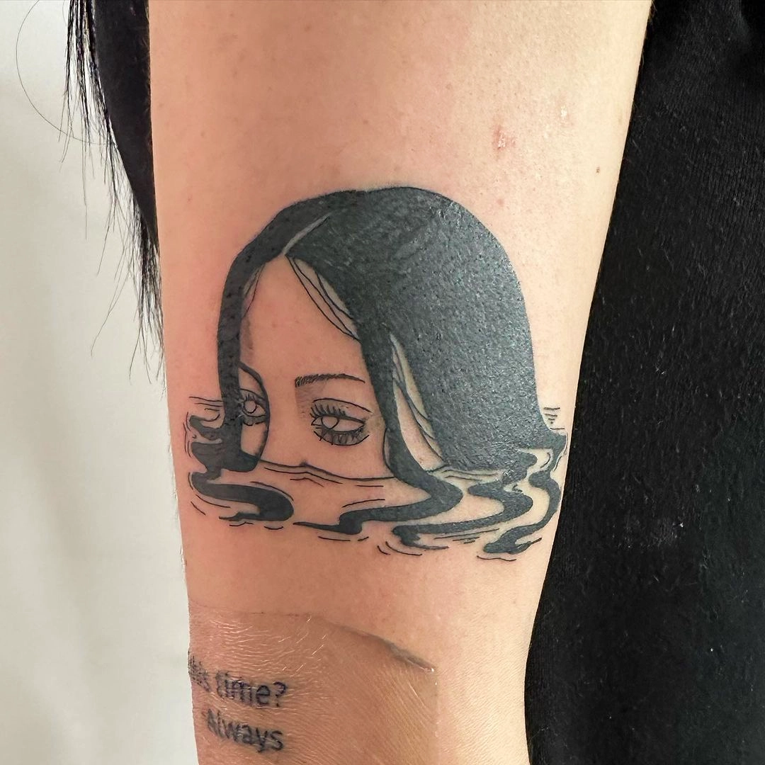 Serene Woman Water Reflection Tattoo