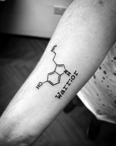 Serotonin warrior tattoo symbolizes resilience and courage in heartfelt story.