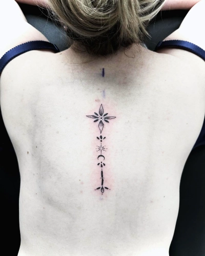 Simplistic Spine Flower Tattoo