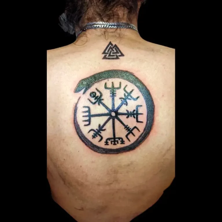 Symbolic Compass Guiding Tattoo